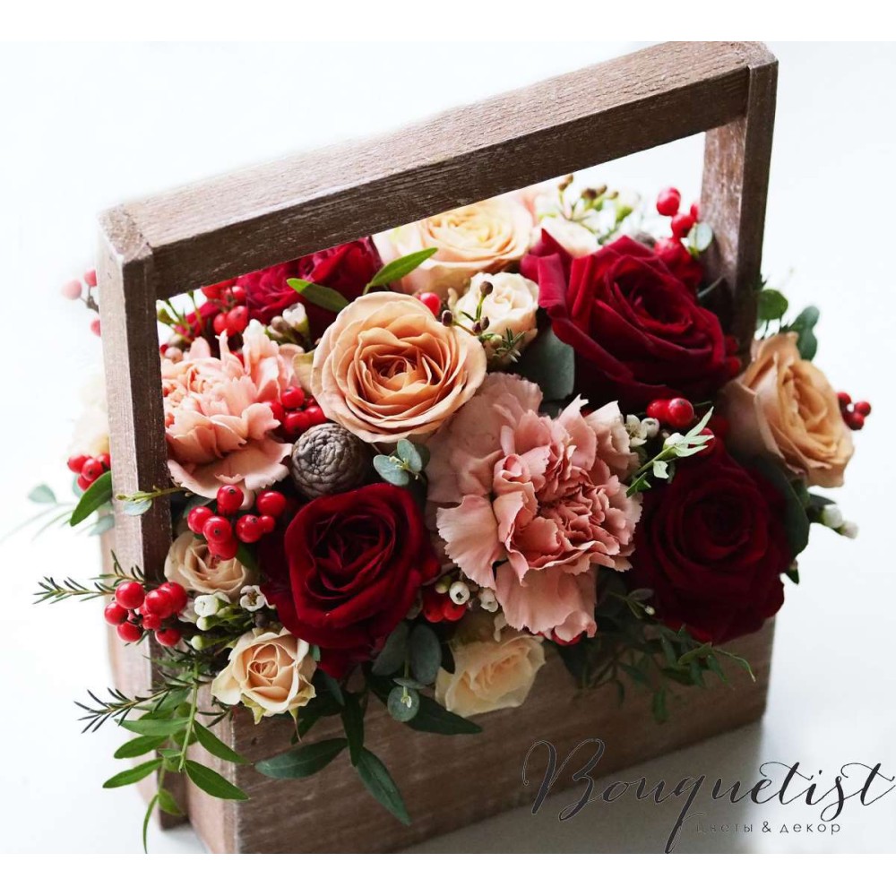 Сoffee-burgundy bouquet of roses and carnations in a wooden box
